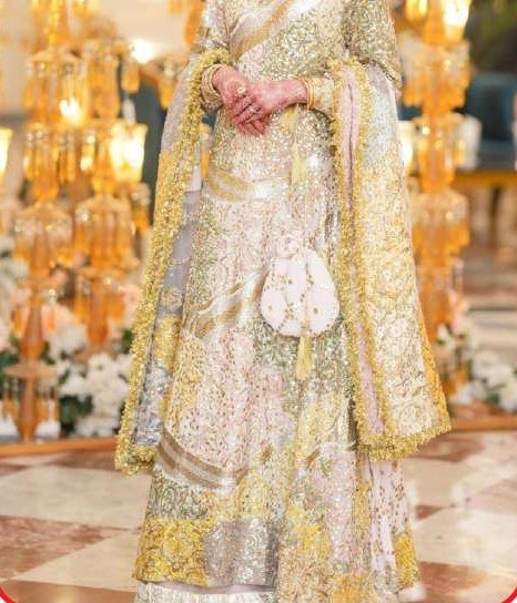 Pastel and gold embroidered ensemble with a tasselled dupatta